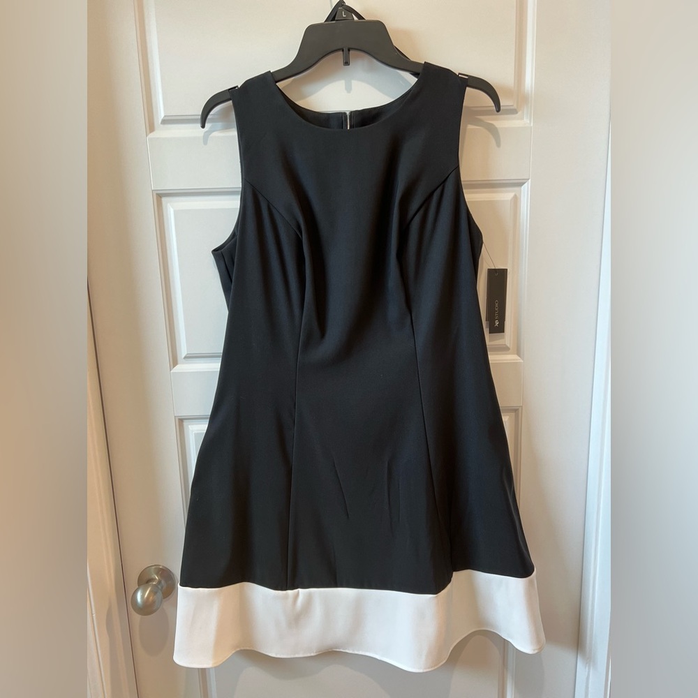 AB Studios Black sleeveless dress with white ribbon around the bottom edge.